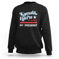Black crewneck sweatshirt with vintage star “Kamala Harris is still my president” print