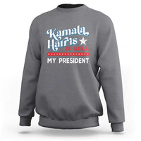 Charcoal gray crewneck sweatshirt with vintage star “Kamala Harris is still my president” print