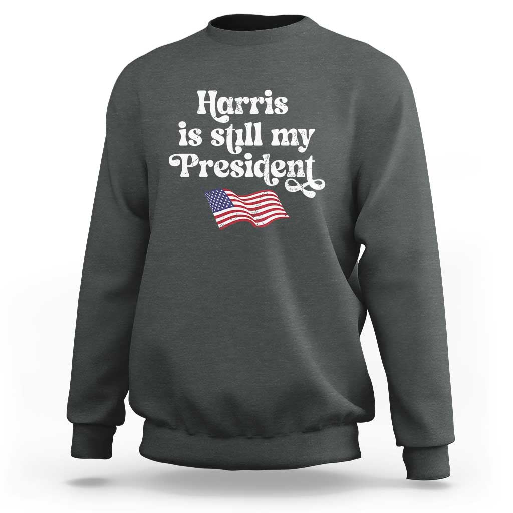 Charcoal gray sweatshirt with 'Harris is still my President' design and mini American flag