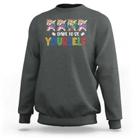 Charcoal crewneck sweatshirt with colorful unicorn graphic and “Dare to be yourself” text