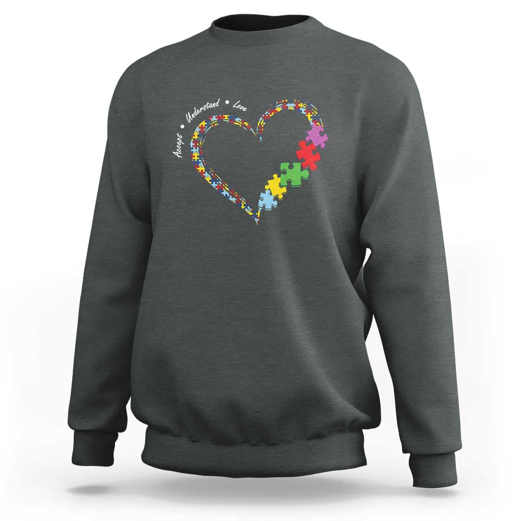 Charcoal gray sweatshirt with heart puzzle-piece graphic and autism awareness text