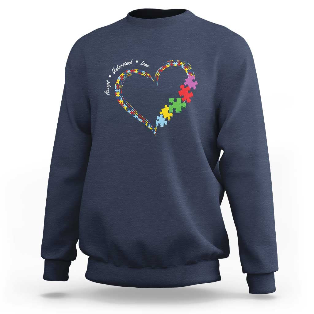 Navy sweatshirt with heart puzzle-piece graphic and autism awareness text