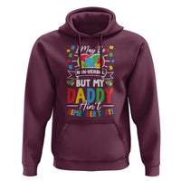 Maroon pullover hoodie with autism puzzle graphic and dad quote 'Non-Verbal'.