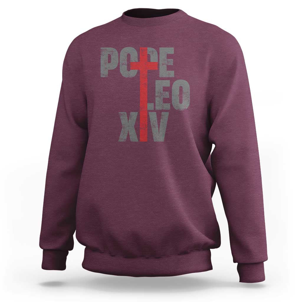 Men's maroon sweatshirt with red cross graphic and Pope lettering on chest