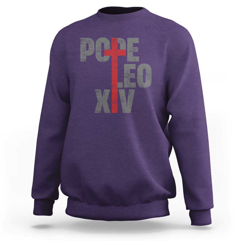 Men's purple sweatshirt with red cross graphic and Pope lettering on chest