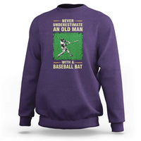 Purple men's baseball sweatshirt with back graphic of a baseball player holding a bat