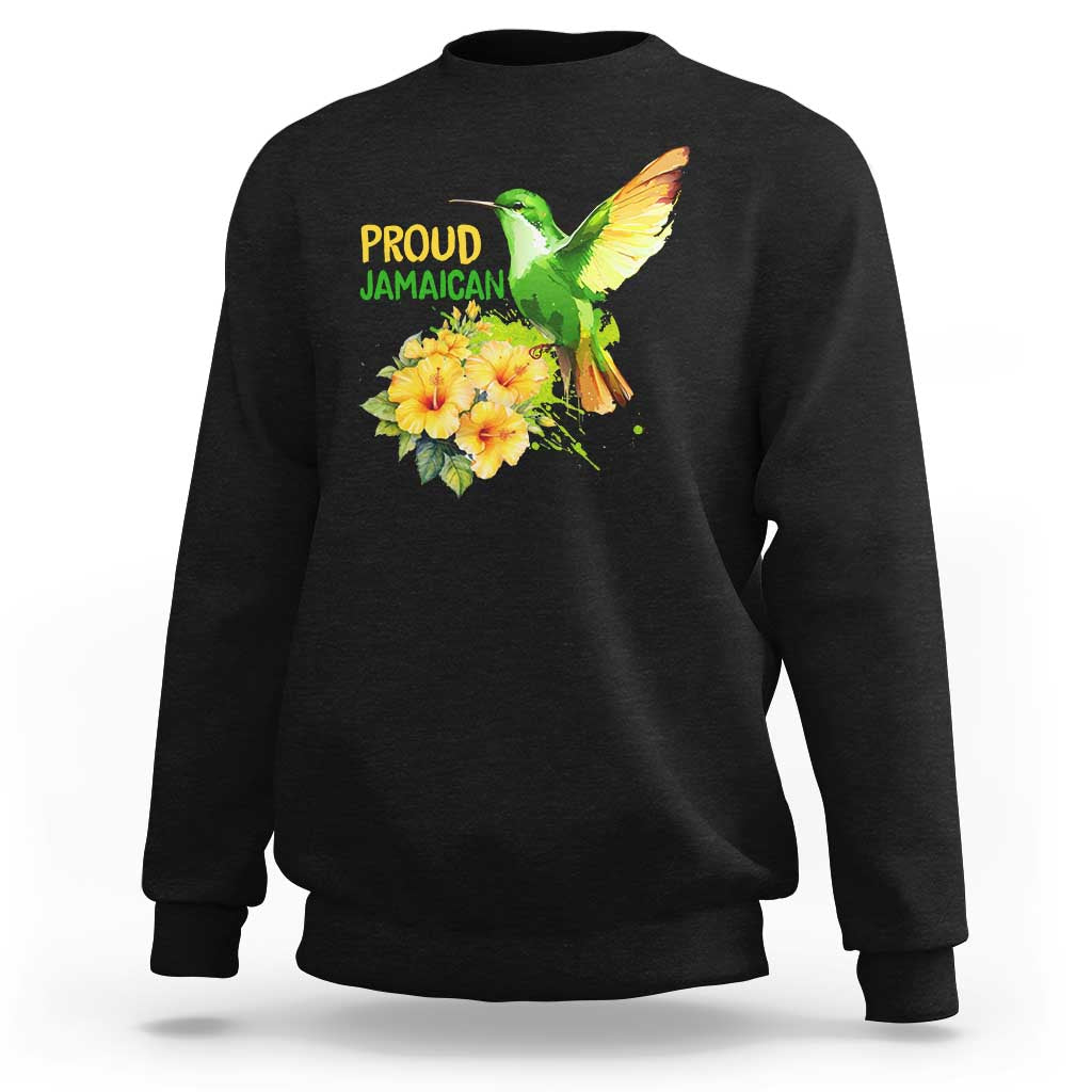 Black sweatshirt with “PROUD JAMAICAN” text, hummingbird and flower hibiscus graphic