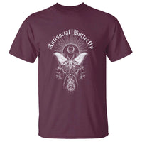 Maroon graphic T-shirt with large moon-and-butterfly emblem on the chest