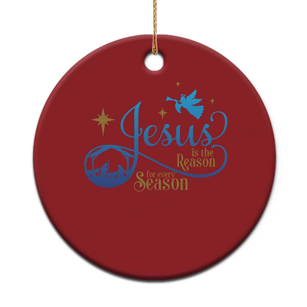 Red round Christmas ornament with blue “Jesus is the Reason for Season” design
