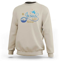 Sand sweatshirt with blue nativity “Jesus … the Season” graphic on the chest