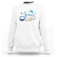 White sweatshirt with blue nativity “Jesus … the Season” graphic on the chest