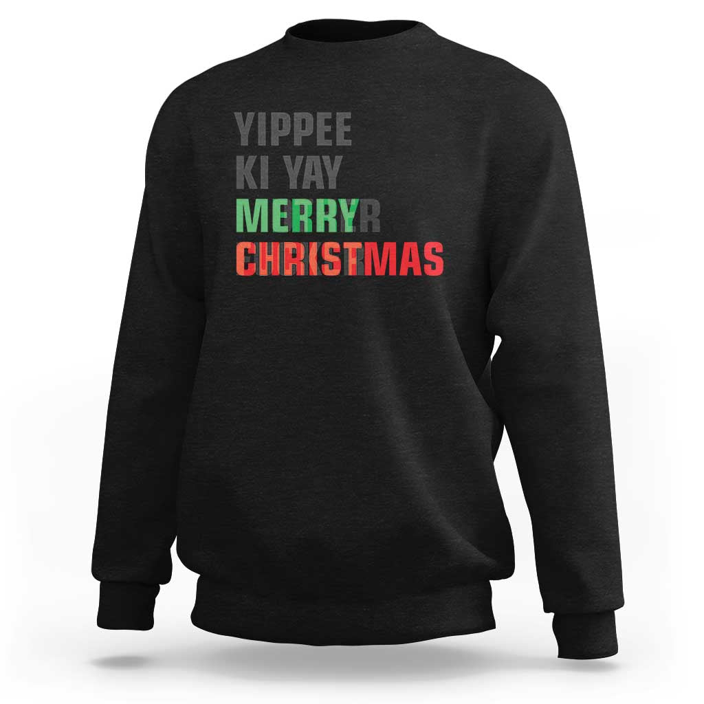 Black crewneck sweatshirt with colorful “MERRY CHRISTMAS” and “VIPPEE KI YAY” text graphic