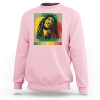 Light pink sweatshirt with reggae portrait graphic and “ROOTS REGGAE” text on front.