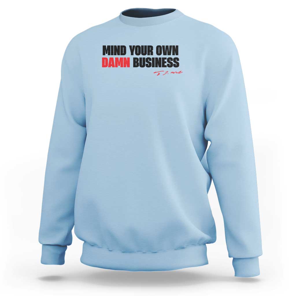 Light blue sweatshirt with “MIND YOUR OWN DAMN BUSINESS” graphic on chest