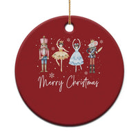 Red round Christmas ornament with nutcracker, ballerina mouseking, and “Merry Christmas”