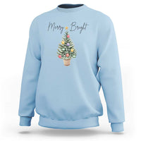 Light blue crewneck sweatshirt with Merry Bright text and Christmas tree graphic