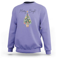 Violet crewneck sweatshirt with Merry Bright text and decorated Christmas tree graphic