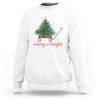 White Christmas sweatshirt with wagoned Christmas tree graphic and “merry + bright” text