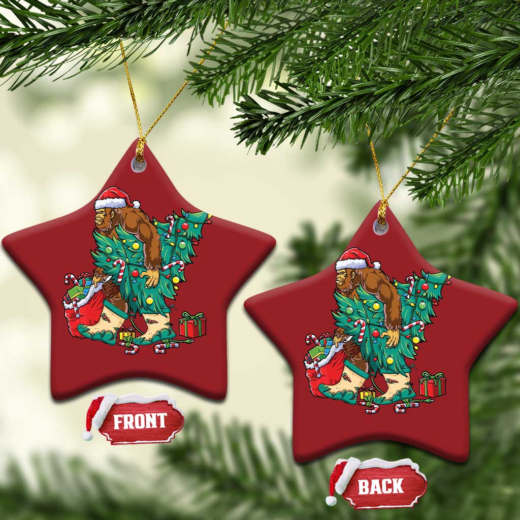Two red star-shaped ornaments with cartoon Bigfoot Santa decorating a Christmas tree.