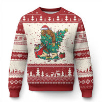 Red crewneck ugly Christmas sweater with Bigfoot-and-tree graphic and festive border