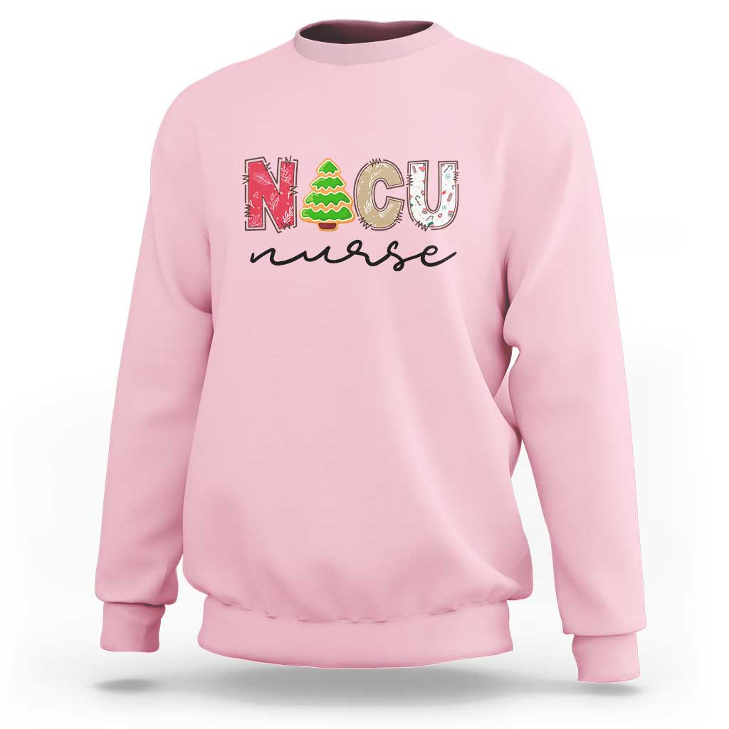 Light pink crewneck sweatshirt with “NICU nurse” Christmas tree graphic