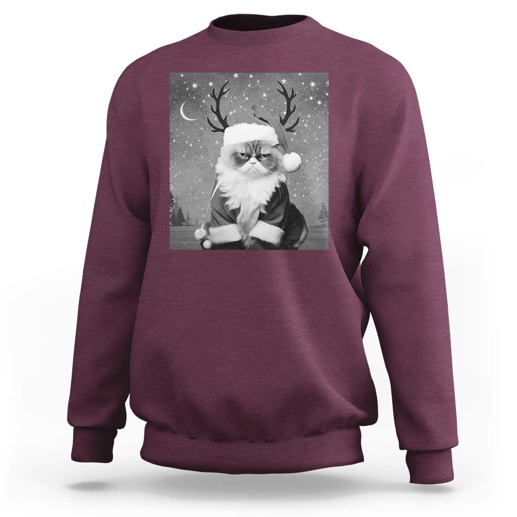 Maroon crewneck sweatshirt with long sleeves and a Santa-cat graphic on the front