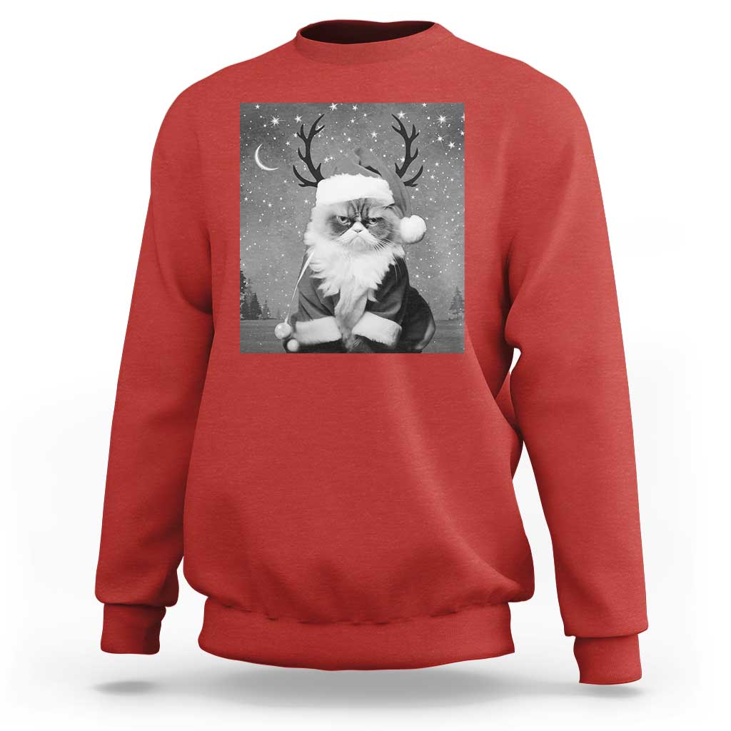 Red crewneck sweatshirt with long sleeves and a Santa-cat graphic on the front