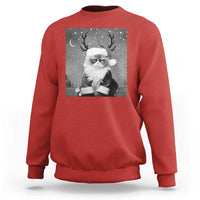 Red crewneck sweatshirt with long sleeves and a Santa-cat graphic on the front