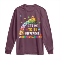 Purple long sleeve autism awareness T-shirt with rainbow giraffe puzzle graphic
