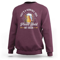 Maroon sweatshirt with 'Please Hold My Beer' graphic and beer mug illustration