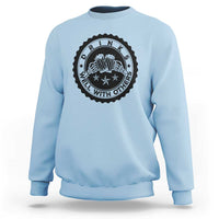 Light blue crewneck sweatshirt with black circular drink graphic on the chest.
