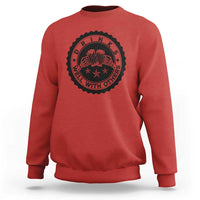 Red crewneck sweatshirt with black circular drink graphic on the chest.