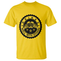 Daisy yellow T-shirt with black round graphic print on the chest