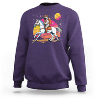 Purple crewneck sweatshirt with astronaut cowboy graphic and planet print on front