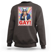 Crewneck sweatshirt in dark brown with colorful “GAY!” Uncle Sam pride graphic on chest.
