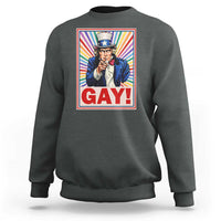 Crewneck sweatshirt in dark gray with colorful “GAY!” Uncle Sam pride graphic on chest.