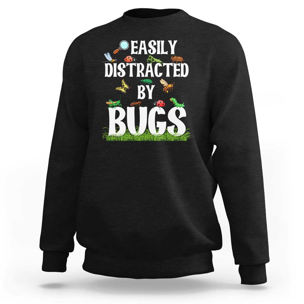 Black sweatshirt with colorful “Bugs” insect graphic on the front