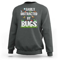 Charcoal gray sweatshirt with colorful “Bugs” insect graphic on the front