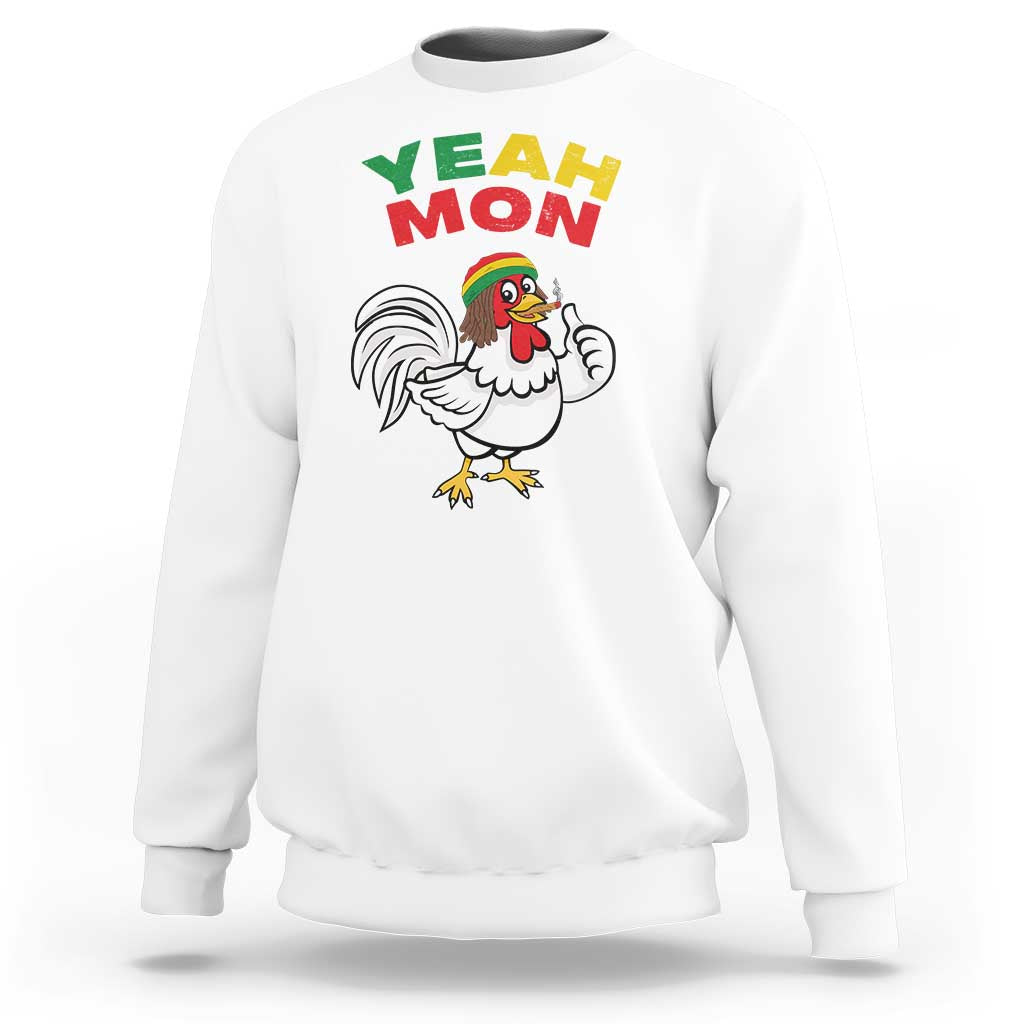 White crewneck sweatshirt with “YEAH MON” text and rooster graphic on front