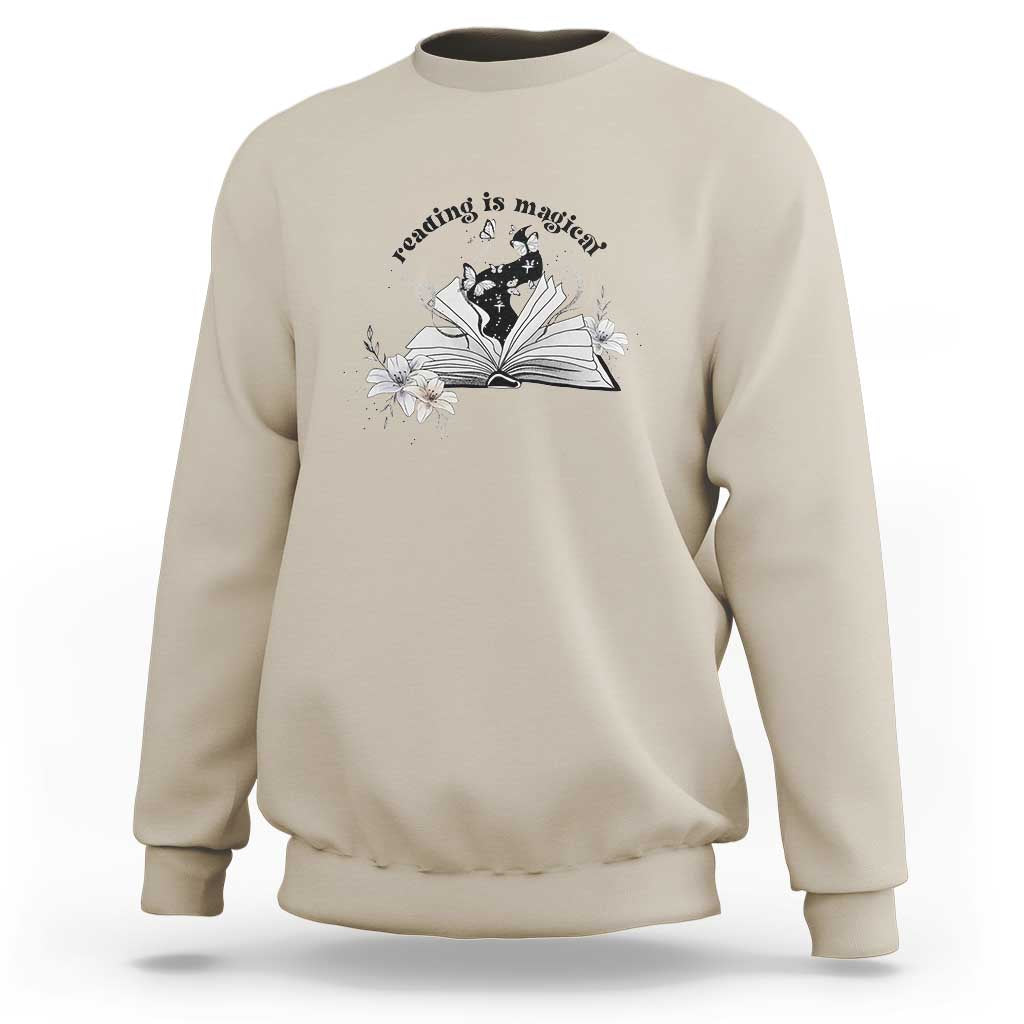 Sand beige sweatshirt with open book and flower graphic plus 'Reading is magical' text