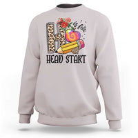 Ice gray kids crewneck sweatshirt with “Head Start” pencil, apple, and flower graphic.