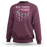 Maroon crewneck sweatshirt with Halloween skeleton ballet dancer graphic on back
