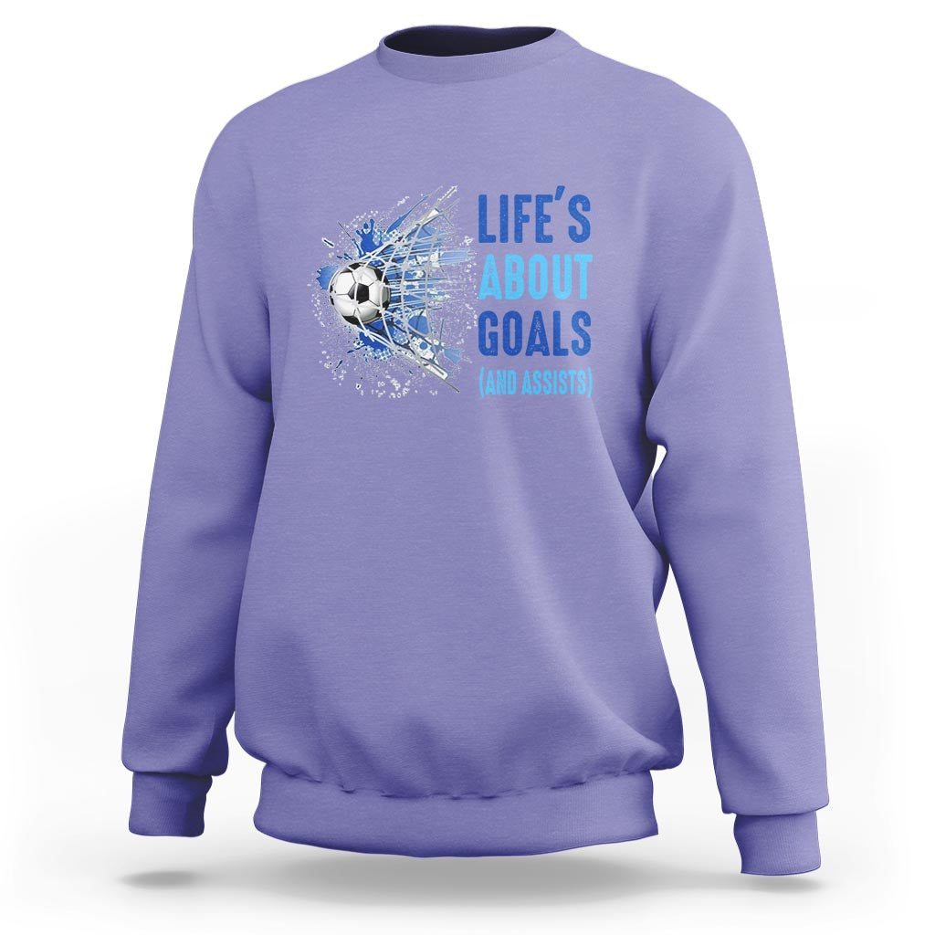 Lavender soccer sweatshirt with blue “Life’s About Goals (and Assists)” graphic on chest