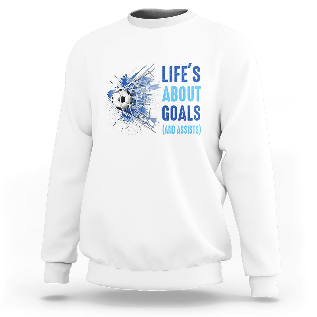 White soccer sweatshirt with blue “Life’s About Goals (and Assists)” graphic on chest
