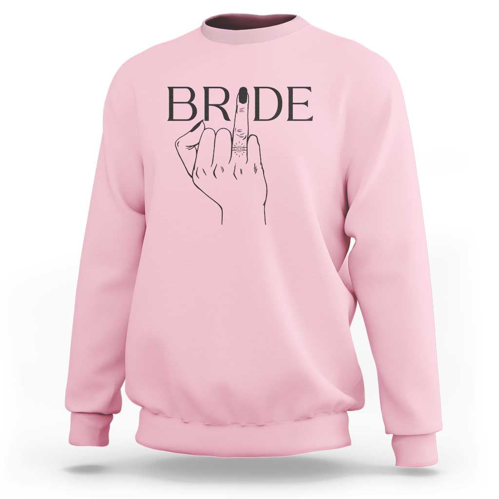 Light pink bride sweatshirt with “BRIDE” print and hand ring graphic on chest