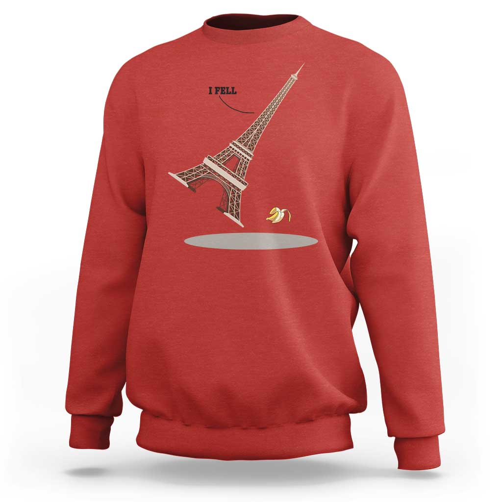 Red Eiffel Tower graphic sweatshirt with “I FELL” text and banana peel design