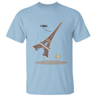 Light blue T-shirt with Eiffel Tower graphic, “I FELL” text, and banana peel at base
