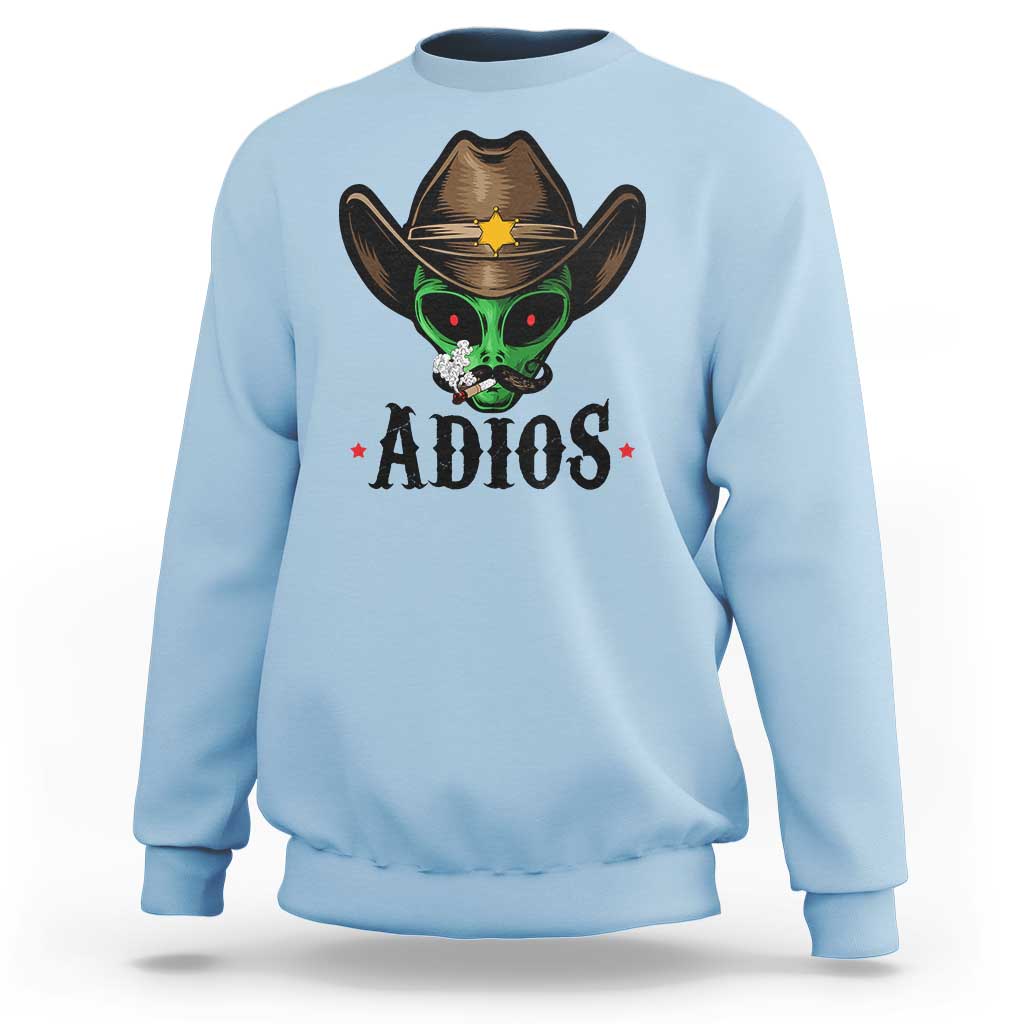 Light blue crewneck sweatshirt with alien cowboy hat graphic and ADIOS print