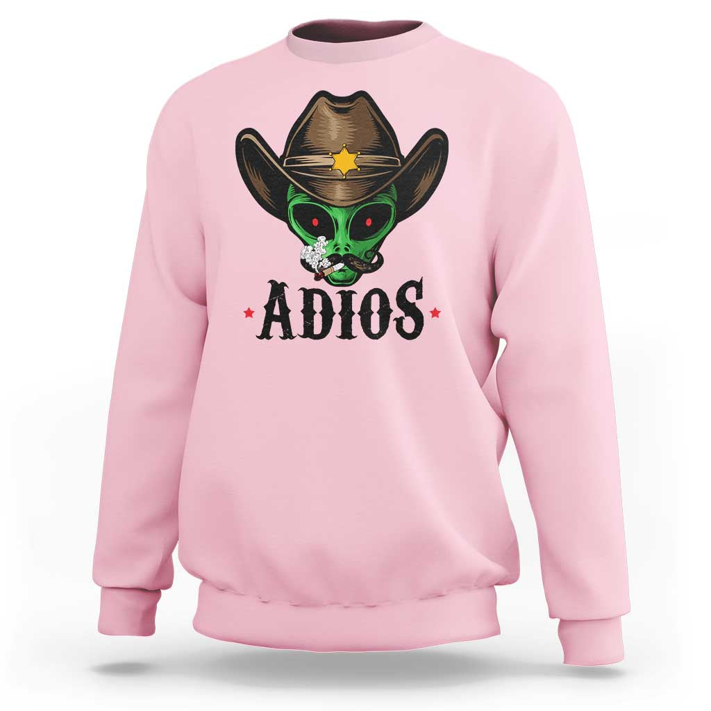 Light pink crewneck sweatshirt with alien cowboy hat graphic and ADIOS print