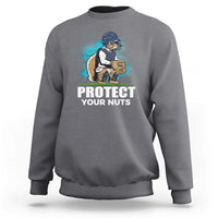 Gray crewneck sweatshirt with baseball squirrel graphic and “PROTECT YOUR NUTS” print